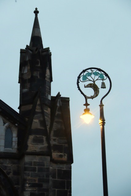 A Tower and decorative lamp standard