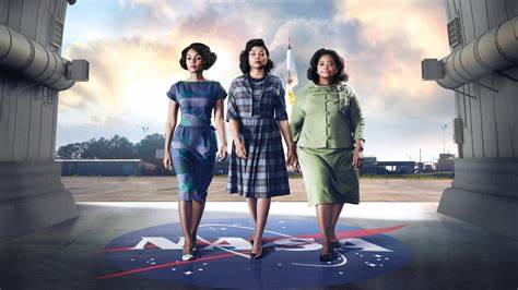 Three women pictured at a NASA facility